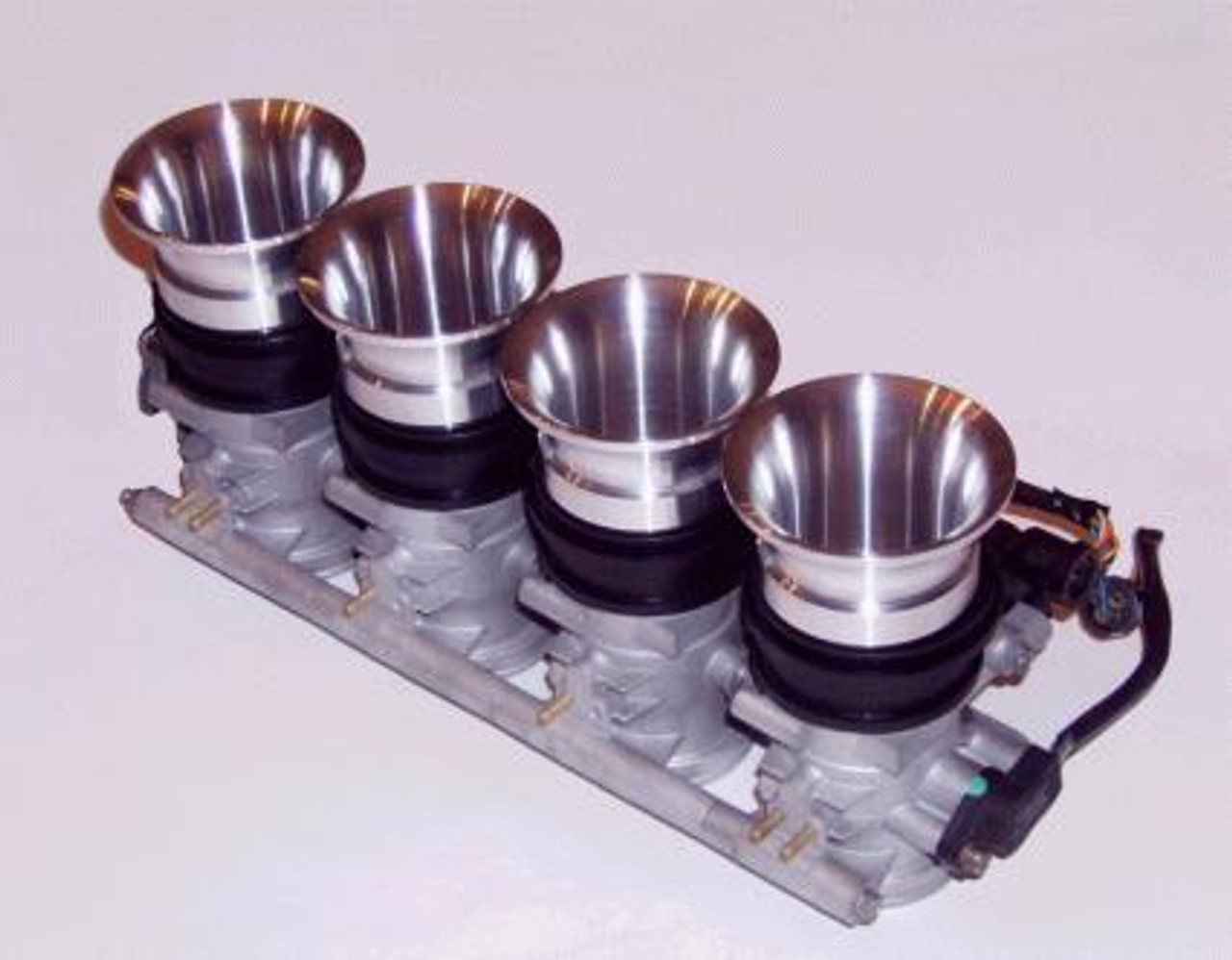 Schnitz Racing Schnitz Billet Velocity Stacks Suzuki GSX1300R Hayabusa (99-07), close-up image of the polished billet velocity stacks installed on a motorcycle intake manifold for improved airflow and performance.