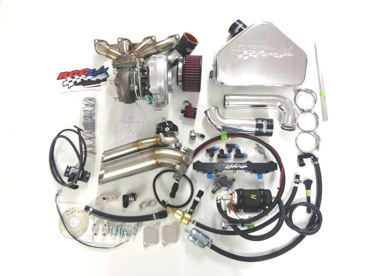 RCC Turbo Kit Stage 2 Suzuki Hayabusa (08-20), high-performance turbocharged motorcycle engine parts and components displayed on a white surface. RCC Turbo Kit Stage 2 Suzuki Hayabusa (08-20), high-performance turbocharged motorcycle engine parts and components displayed on a white surface.