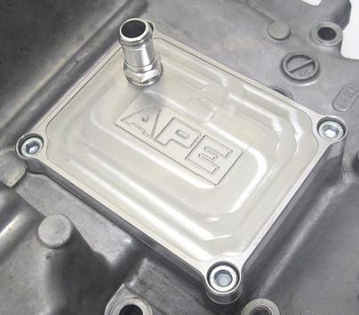 APE Low Profile Crankcase Breather Cover Plate Suzuki Hayabusa (99-26), close-up of the metallic cover plate with engraved logo, installed on motorcycle engine.