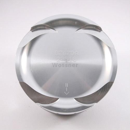 Wossner Piston Kit Kawasaki ZX10R (04-24), close-up of a metallic piston with engraved markings and curved surface for engine performance.