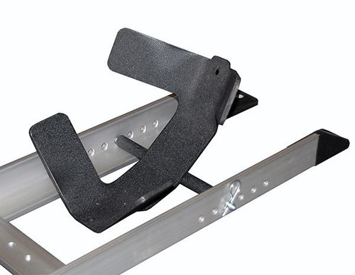 Condor Pit Stop/Trailer Wheel Chock, sturdy black wheel restraint with rubber-coated support on a metal rail for secure parking of trailers and vehicles.