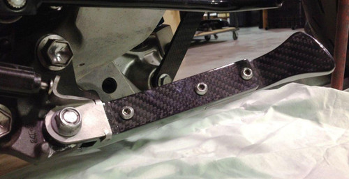 Montgomery Motorsports Carbon Fiber Adjustable Kickstand Suzuki Hayabusa (99-20), close-up view of the carbon fiber kickstand attached to a Suzuki Hayabusa motorcycle. Montgomery Motorsports Carbon Fiber Adjustable Kickstand Suzuki Hayabusa (99-20), close-up view of the carbon fiber kickstand attached to a Suzuki Hayabusa motorcycle.