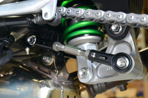 Brocks Performance Brocks Window Lowering Link Kawasaki Ninja H2/R (15-23), Ninja H2 SX / SE /SE+ (18-21), Z H2 (20-23), close-up of motorcycle chain, rear suspension, and lowering link component. Brocks Performance Brocks Window Lowering Link Kawasaki Ninja H2/R (15-23), Ninja H2 SX / SE /SE+ (18-21), Z H2 (20-23), close-up of motorcycle chain, rear suspension, and lowering link component.