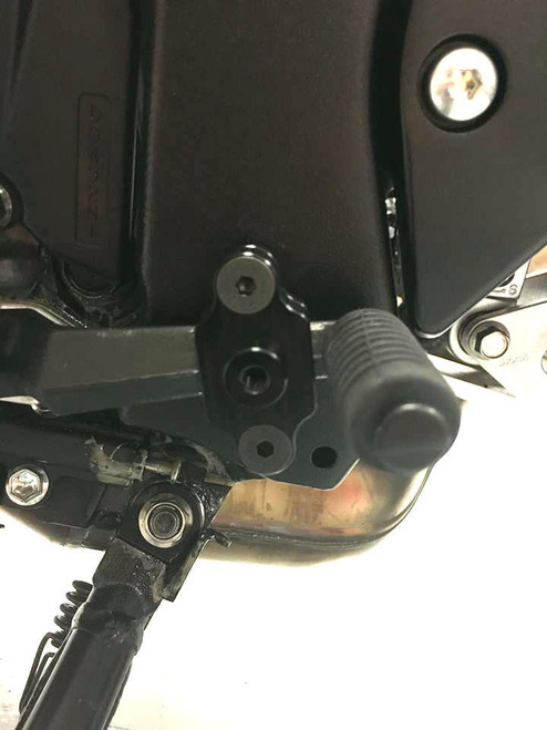HTP Performance HTP Air Shifter Bracket Suzuki GSXR1000, close-up of black motorcycle air shifter bracket mounted near the engine on Suzuki GSXR1000 motorcycle. HTP Performance HTP Air Shifter Bracket Suzuki GSXR1000, close-up of black motorcycle air shifter bracket mounted near the engine on Suzuki GSXR1000 motorcycle.