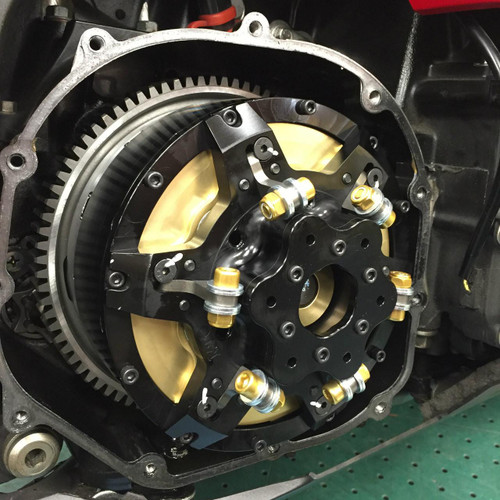 MTC Multistage Lock Up Gen II Clutch Kawasaki ZX14 12-25, close-up of the clutch assembly with black, gold, and metallic components installed in a motorcycle engine.