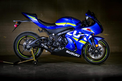 M4 Performance Exhausts M4 GP Black Exhaust Suzuki GSXR1000 (17-25), close-up view of the blue sport motorcycle with black and yellow accents, featuring the M4 GP Black Exhaust system installed. Loading Image