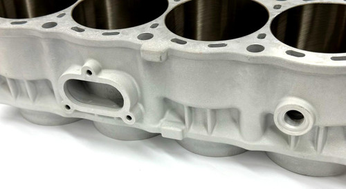 Wossner Cylinder Block Suzuki Hayabusa (99-25), close-up view of the motorcycle engine cylinder block with detailed metal construction and openings for pistons.