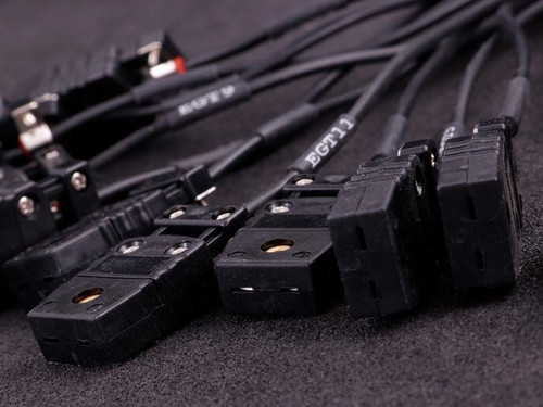 MaxxECU Pro Flying Lead Wiring Harness Connector 2, automotive wiring harness with multiple black connectors and attached wires.