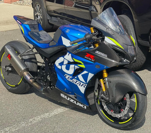 Penske Racing Shocks Penske Lightweight Roll Race Shock, mounted on a Suzuki GSX-R race motorcycle with custom carbon fiber fairings and racing tires.