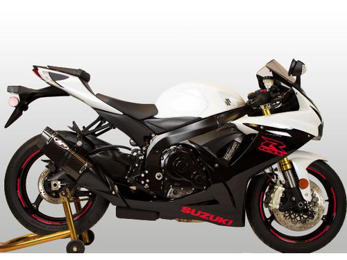 M4 Performance Exhausts M4 Tech1 Carbon Fiber Slip On Exhaust Suzuki GSXR600/750 (11-26), installed on a white and black sport motorcycle, with gold accents and racing tires.