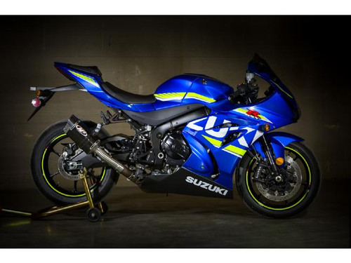 M4 Performance Exhausts M4 Tech1 Carbon Fiber Slip On Exhaust Suzuki GSXR1000 (17-25), installed on a blue Suzuki GSXR1000 motorcycle, with a close-up view of the exhaust system showing its carbon fiber finish and sleek design.