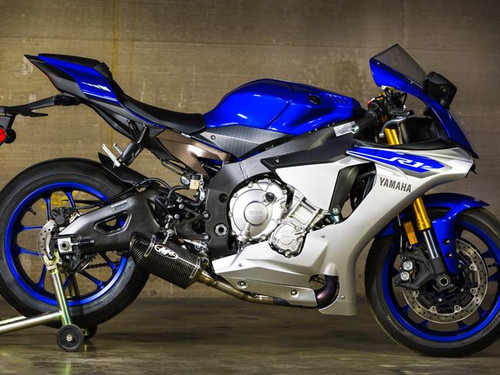 M4 Performance Exhausts M4 Street Slayer Carbon Exhaust Yamaha YZF-R1 (15-24), side view of a blue and white Yamaha R1 motorcycle with a carbon fiber exhaust system installed.