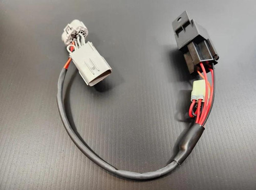 VooDoo Voodoo Ignition Delete Suzuki Hayabusa (22-25), motorcycle ignition delete wiring harness with electronic components on a black surface.