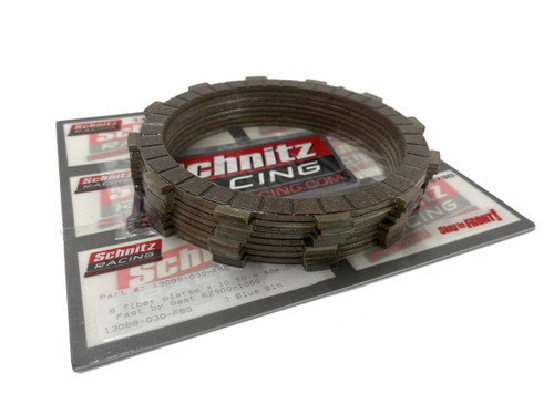 FBG Clutch Fiber Kawasaki KZ900-KZ1000, set of 8 fiber clutch plates stacked on top of their packaging with Schmitz Racing branding.