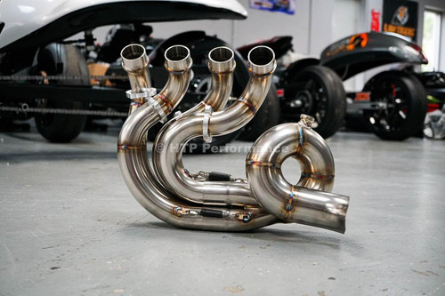 HTP Performance HTP Pigtail Exhaust System for Suzuki GSXR1000 (17-25), stainless steel motorcycle exhaust pipes with four curved outlets displayed on garage floor. Loading Image