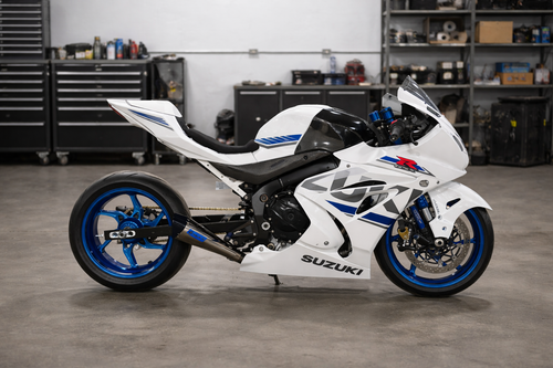 DME Racing 'Roll Race' Swingarm Suzuki GSXR1000 (17-25), black metal swingarm for motorcycle racing and performance upgrades.