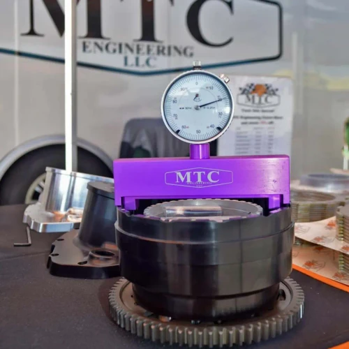 MTC Engineering MTC Air Gap Tool, a precision measuring device used for accurately measuring air gaps in engineering applications, with a dial indicator mounted on a purple base.