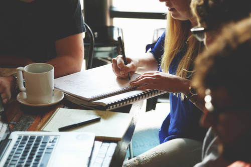 people at a table working together