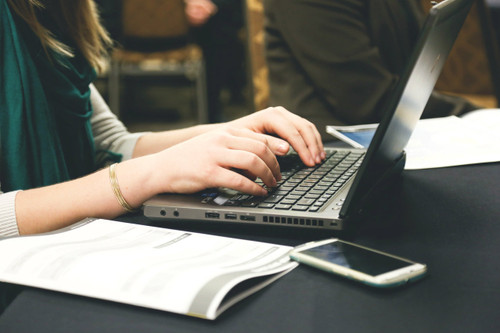 woman works on laptop