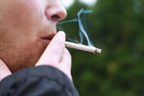 close-up view of someone smoking a cigarette