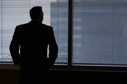 businessman looking out window