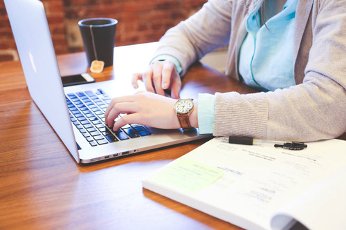 Woman typing on computer Woman typing on computer
