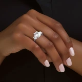 1 2/5 CTW Cushion Lab Created Diamond  with Round Sidestones Three-Stone Engagement Ring in 10K White Gold (MD260015)