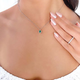 3/5 CTW Oval Green Emerald & Round Diamond Floral Halo Pendant Necklace in 14K White Gold (MDR220130)