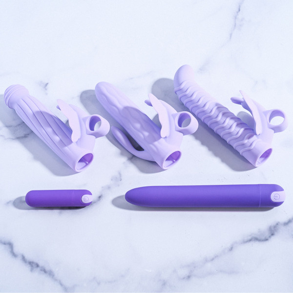 Evolved Novelties - Lilac Desires - 7 pc set includes 1 vibrator, 1 vibrating bullet, 3 unique silicone Butterfly sleeves, 1 anal plug, 1 bullet sleeve with looped handle lifestyle product photo