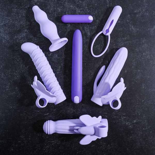 Evolved Novelties - Lilac Desires - 7 pc set includes 1 vibrator, 1 vibrating bullet, 3 unique silicone Butterfly sleeves, 1 anal plug, 1 bullet sleeve with looped handle lifestyle product photo