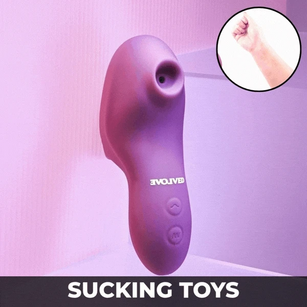 Sucking Toys — pale pink sucking toy held in a hand