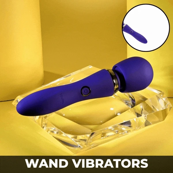 Wand Vibrators — purple wand vibrator with gold accent, held in a hand
