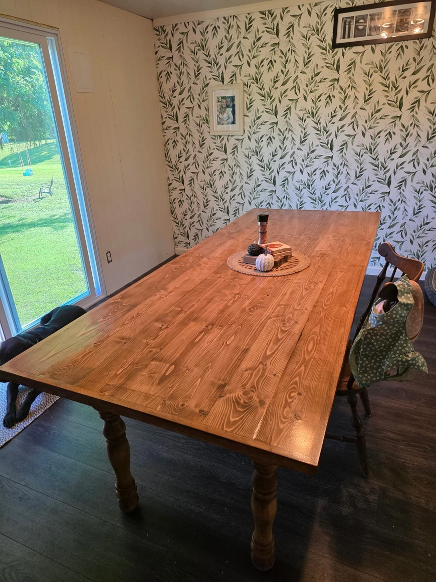Dining table built with round turned wood legs