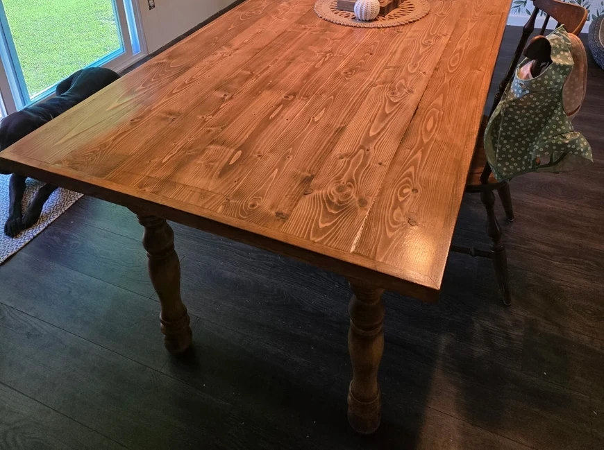 Dining table built with round turned wood legs