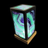 Top view of rainbow fluorite lantern lamp showing purple green clear banding through polished fluorite panel