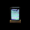 Rainbow fluorite panel lantern lamp lit, black metal frame, wood USB LED base, purple green banding glowing on all four sides