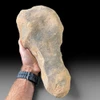 Genuine Acheulean handaxe from North Africa showing bifacial knapping and desert patina