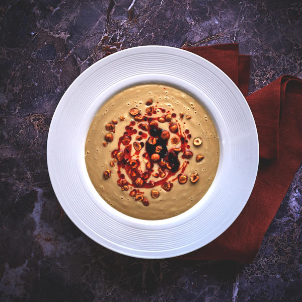 Cauliflower and Almond Milk Veloute with Balsamic Vinegar, Urfa Chilli and Hazelnut Dressing