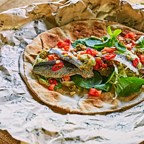 Flatbreads with sardines, Chermoula Yoghurt, Pine Kernels, and tomatoes