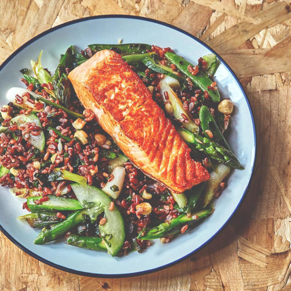 Grilled salmon with Red Rice, charred greens and pickled cucumber salad