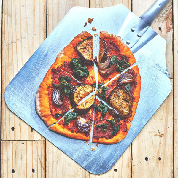 Rose Harissa Pesto pizza with aubergine, spinach and red onion