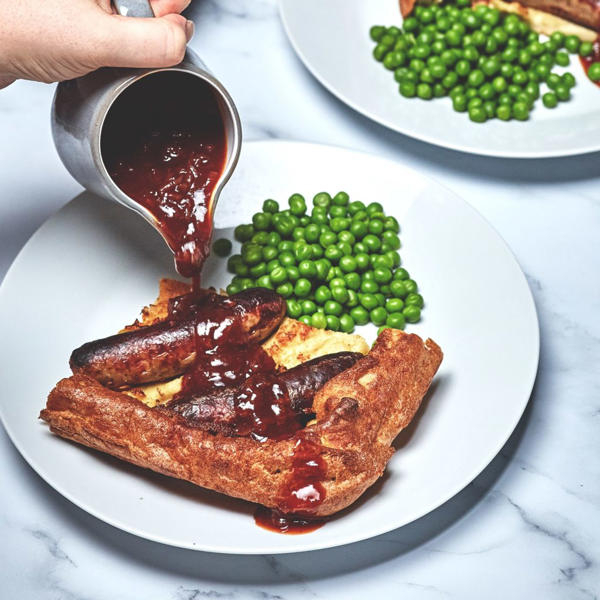 Toad in the Hole with Caramelised Onion and Harissa Ketchup Gravy