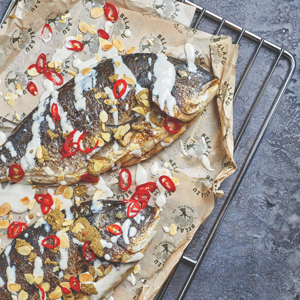 Whole sea bream with Green Tapenade, Tahini, almonds and chilli