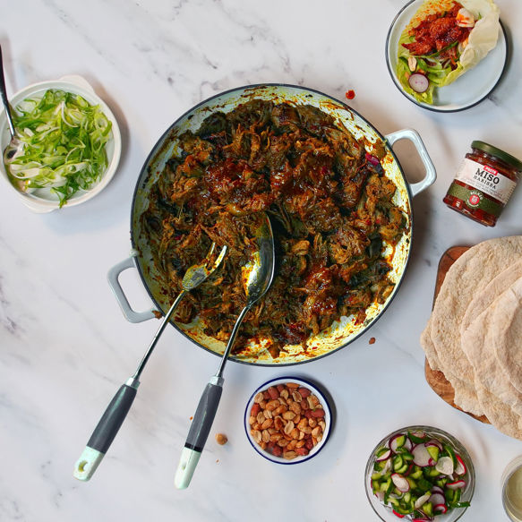 Pulled Lamb Shoulder with Miso Harissa Paste, Flatbread, Pickles and Peanuts