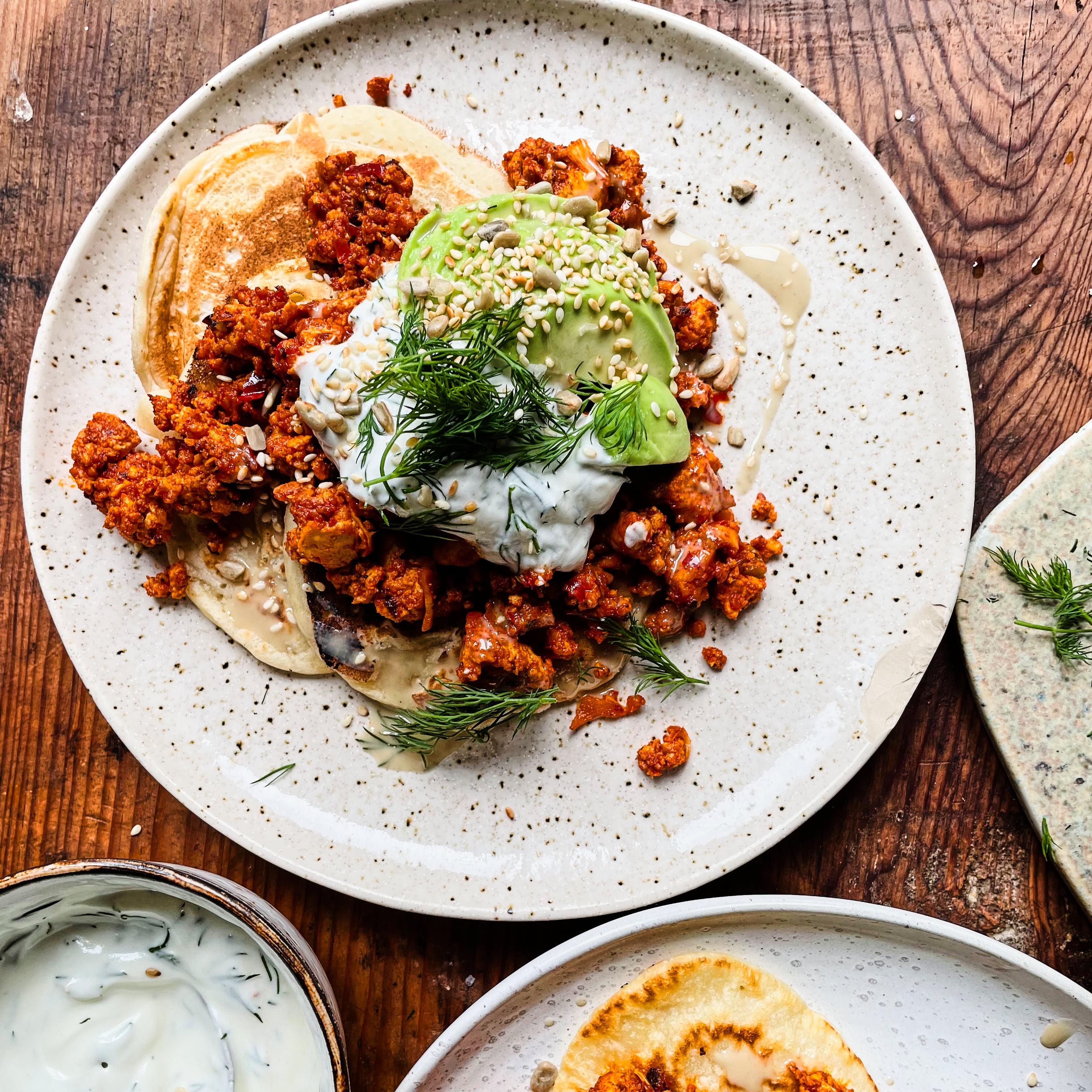 HARISSA SCRAMBLED TOFU PANCAKES WITH AVOCADO AND YOGHURT 