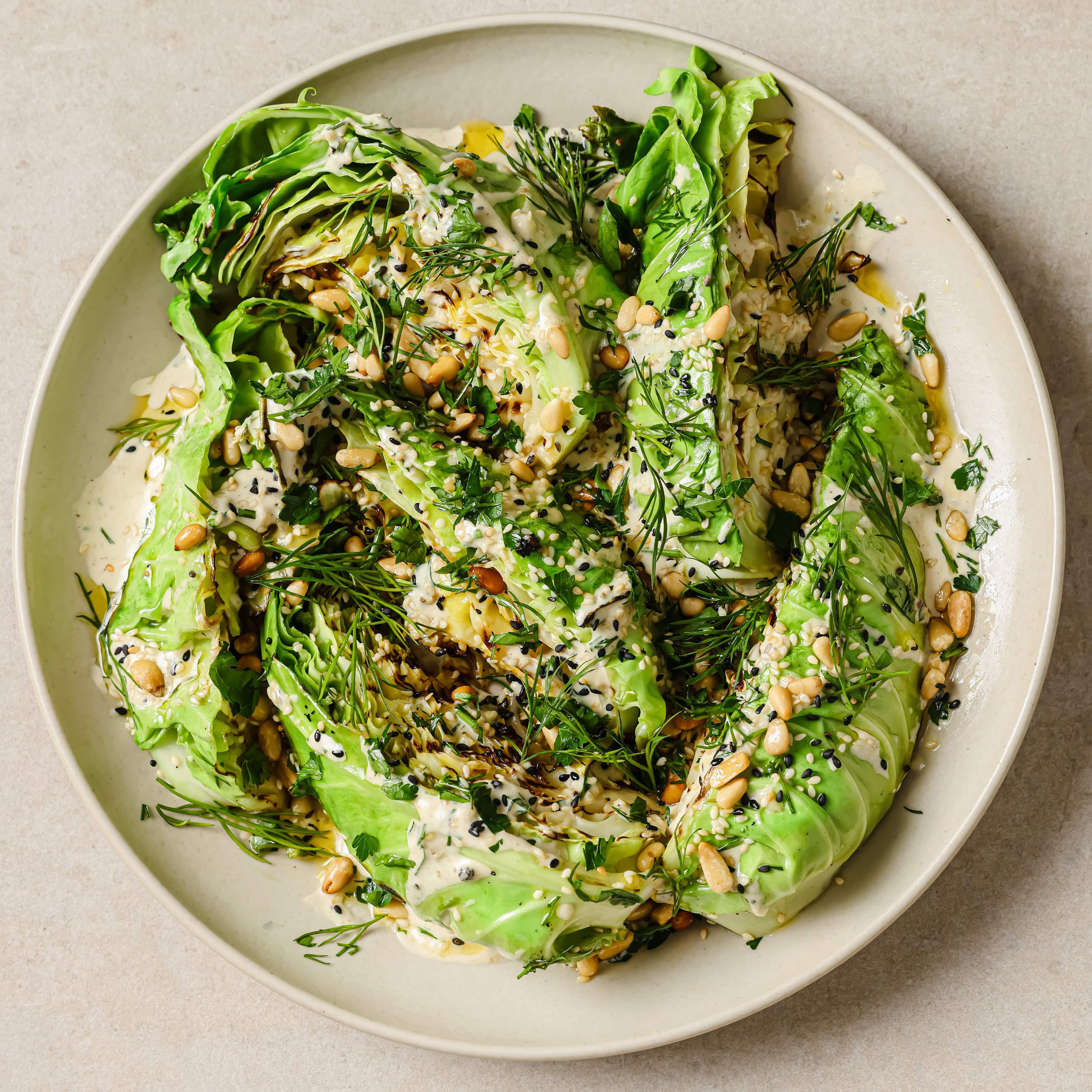 CHARRED HISPI CABBAGE WITH LEMON TAHINI