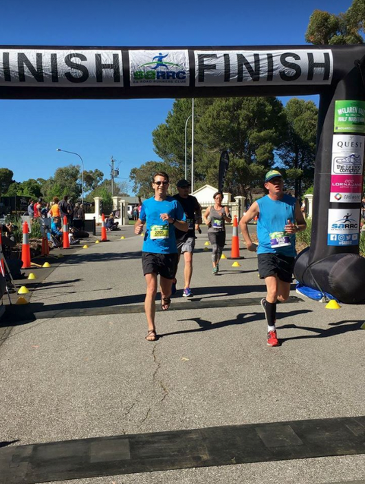 Chris Newby finishes the McLaren Vale Half Marathon in his Z-Trails