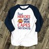 Teacher true heroes don't wear capes they teach unisex raglan shirt