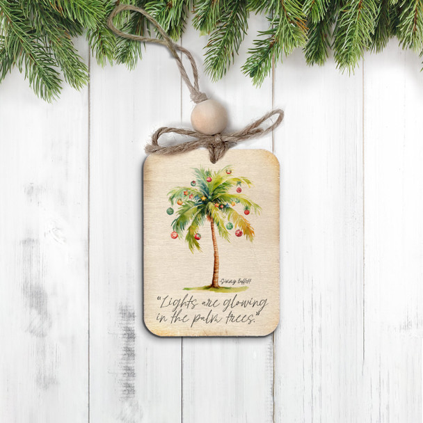 Christmas lights are glowing in the palm trees rustic wood ornament