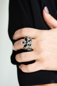 Varying in shape and size, black rhinestones are sprinkled along airy silver petals, coalescing into a glittery flower atop the finger. Features a stretchy band for a flexible fit.
Sold as one individual ring. Varying in shape and size, black rhinestones are sprinkled along airy silver petals, coalescing into a glittery flower atop the finger. Features a stretchy band for a flexible fit.
Sold as one individual ring.